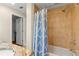 Bathroom featuring a shower with tile surround and a view of the closet and sink at 705 S West Shore Blvd, Tampa, FL 33609
