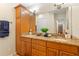 Spacious bathroom featuring granite countertops, dual sinks, and well-lit mirrors at 705 S West Shore Blvd, Tampa, FL 33609