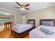 Charming bedroom with twin beds and view to recreation room with pool table at 705 S West Shore Blvd, Tampa, FL 33609