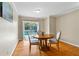 Dining room with a round table and view to the pool through sliding glass doors at 705 S West Shore Blvd, Tampa, FL 33609