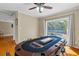 Home game room showcasing the poker table and sliding glass door with pool view at 705 S West Shore Blvd, Tampa, FL 33609