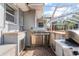 Outdoor kitchen with stainless steel grill, sink and counter space, perfect for entertaining at 705 S West Shore Blvd, Tampa, FL 33609