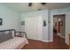 Bedroom with hardwood floors, a ceiling fan, and a closet at 7182 Griffin Rd, Brooksville, FL 34601