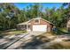 Charming single-story home with a well-maintained lawn, screened in porch and an attached two car garage at 7182 Griffin Rd, Brooksville, FL 34601