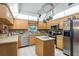 Bright kitchen featuring stainless appliances and mosaic backsplash at 7182 Griffin Rd, Brooksville, FL 34601