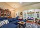 Bright living room with a plush sectional, large windows, and tasteful decor creating an inviting atmosphere at 7182 Griffin Rd, Brooksville, FL 34601