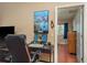 Home office features a computer desk, black leather chair and decor at 7182 Griffin Rd, Brooksville, FL 34601