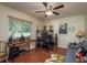 Home office with dark wood floors, a desk and sofa at 7182 Griffin Rd, Brooksville, FL 34601