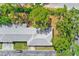 Aerial view showcasing roof and landscaping of a well-maintained residential property with mature trees at 8066 Brentwood Rd # 8066, Seminole, FL 33777
