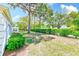 Lush backyard featuring mature trees and well-maintained landscaping, perfect for outdoor relaxation and activities at 8066 Brentwood Rd # 8066, Seminole, FL 33777