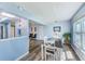 Dining room filled with natural light offers stylish flooring and modern decor at 8066 Brentwood Rd # 8066, Seminole, FL 33777