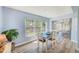 Bright dining room with large window and hardwood flooring at 8066 Brentwood Rd # 8066, Seminole, FL 33777