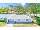 Inviting single-story home features a well-kept lawn, attached garage, and peaceful residential street at 8066 Brentwood Rd # 8066, Seminole, FL 33777