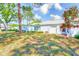 Charming single-story home with well-maintained lawn, a garage and mature trees, creating a peaceful and inviting atmosphere at 8066 Brentwood Rd # 8066, Seminole, FL 33777