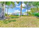Home with green grass and mature trees at 8066 Brentwood Rd # 8066, Seminole, FL 33777
