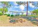 Charming single-story home with well-maintained lawn and mature trees, creating a peaceful and inviting atmosphere at 8066 Brentwood Rd # 8066, Seminole, FL 33777