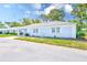 A light blue home with green grass and landscaping at 8066 Brentwood Rd # 8066, Seminole, FL 33777