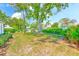 A lush front yard with green grass and trees at 8066 Brentwood Rd # 8066, Seminole, FL 33777