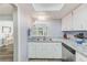 Kitchen with stainless steel dishwasher, neutral countertops and cabinetry, and a double sink at 8066 Brentwood Rd # 8066, Seminole, FL 33777