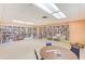 Well-stocked community library with floor-to-ceiling bookshelves, reading tables, and a quiet atmosphere for residents at 8066 Brentwood Rd # 8066, Seminole, FL 33777