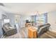 Cozy living room with wood-look floors, a ceiling fan, and comfortable seating at 8066 Brentwood Rd # 8066, Seminole, FL 33777