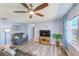 Relaxing living room features stylish decor, a ceiling fan, and ample natural light at 8066 Brentwood Rd # 8066, Seminole, FL 33777