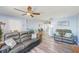 Spacious living room with wood-look floors and comfortable sofa seating at 8066 Brentwood Rd # 8066, Seminole, FL 33777