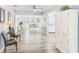 Open-concept living space with wood-look floors and natural light at 8066 Brentwood Rd # 8066, Seminole, FL 33777