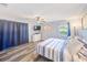Comfortable bedroom featuring modern ceiling fan, tv, and a calming color scheme at 8066 Brentwood Rd # 8066, Seminole, FL 33777