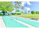 Enjoy shuffleboard in the community's recreational area surrounded by lush greenery at 8066 Brentwood Rd # 8066, Seminole, FL 33777