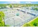 Aerial view of multiple well-maintained tennis courts within the community, perfect for recreation at 8066 Brentwood Rd # 8066, Seminole, FL 33777