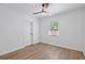 Clean and simple bedroom with wood floors and bright, natural light from the window at 828 20Th S Ave, St Petersburg, FL 33705