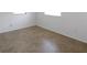 Serene bedroom showcasing tiled flooring, neutral paint, and plenty of natural light at 9325 Saint Regis Ln, Port Richey, FL 34668