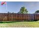 Solid wood fence enclosing the backyard, providing privacy and security for the property at 9420 Kiowa Dr, New Port Richey, FL 34654
