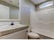 Well-lit bathroom with a white vanity, framed mirror, and a clean, white shower-tub combo at 9420 Kiowa Dr, New Port Richey, FL 34654