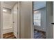Hallway view of the bathroom and bedroom with wood-look flooring at 9420 Kiowa Dr, New Port Richey, FL 34654