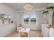 Bright Bedroom with crib, windows and modern decor creating a cozy and inviting space at 9825 Autumn Ridge Ave, Riverview, FL 33578