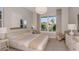 Calming bedroom with a large window, neutral tones, and comfortable furnishings at 9825 Autumn Ridge Ave, Riverview, FL 33578