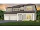Charming new construction two-story home with a three-car garage, lush lawn, and welcoming entryway at 9825 Autumn Ridge Ave, Riverview, FL 33578
