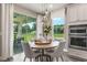 Cozy dining area with views of the backyard and access to the outdoor patio at 9827 Crescent Moon Dr, Riverview, FL 33578