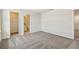 The bedroom offers an open closet, neutral carpet, and an ensuite bathroom at 9832 Crescent Moon Dr, Riverview, FL 33578