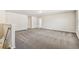 Spacious living room with neutral carpet, recessed lighting, and ample natural light at 9832 Crescent Moon Dr, Riverview, FL 33578