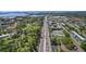 Expansive aerial view featuring a roadway surrounded by lush landscaping and neighborhood amenities at 9940 47Th N Ave # 210, St Petersburg, FL 33708