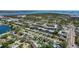 Wide aerial shot of neighborhood, emphasizing tree coverage and community layout at 9940 47Th N Ave # 210, St Petersburg, FL 33708
