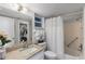 Clean bathroom features a vanity, toilet, shower, and a convenient walk-in closet nearby at 9940 47Th N Ave # 210, St Petersburg, FL 33708