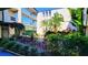Beautiful courtyard with lush tropical landscaping and well-maintained pathways at 9940 47Th N Ave # 210, St Petersburg, FL 33708
