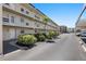 Exterior view of the condo complex showing well-maintained landscaping and building architecture at 9940 47Th N Ave # 210, St Petersburg, FL 33708