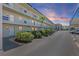 Condo building with well-maintained landscaping and ample parking at 9940 47Th N Ave # 210, St Petersburg, FL 33708
