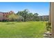 Well-maintained green space with mature trees for shade and outdoor enjoyment at 9940 47Th N Ave # 210, St Petersburg, FL 33708