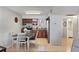 Kitchen and dining area with stainless appliances and tile flooring at 9940 47Th N Ave # 210, St Petersburg, FL 33708